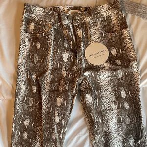 Snake skin print flared jeans